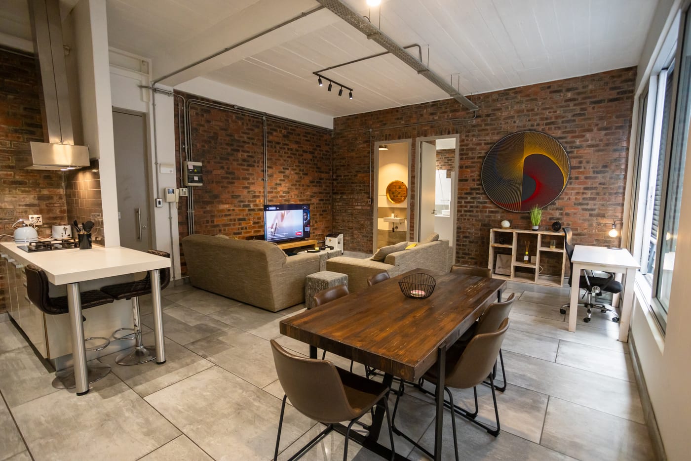 Dining area and workspace in the Gardens apartment