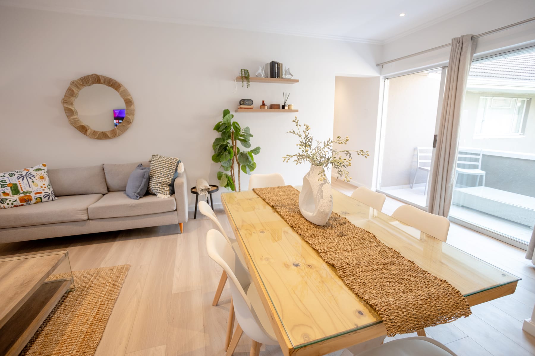 Dining table beside the lounge and balcony doors