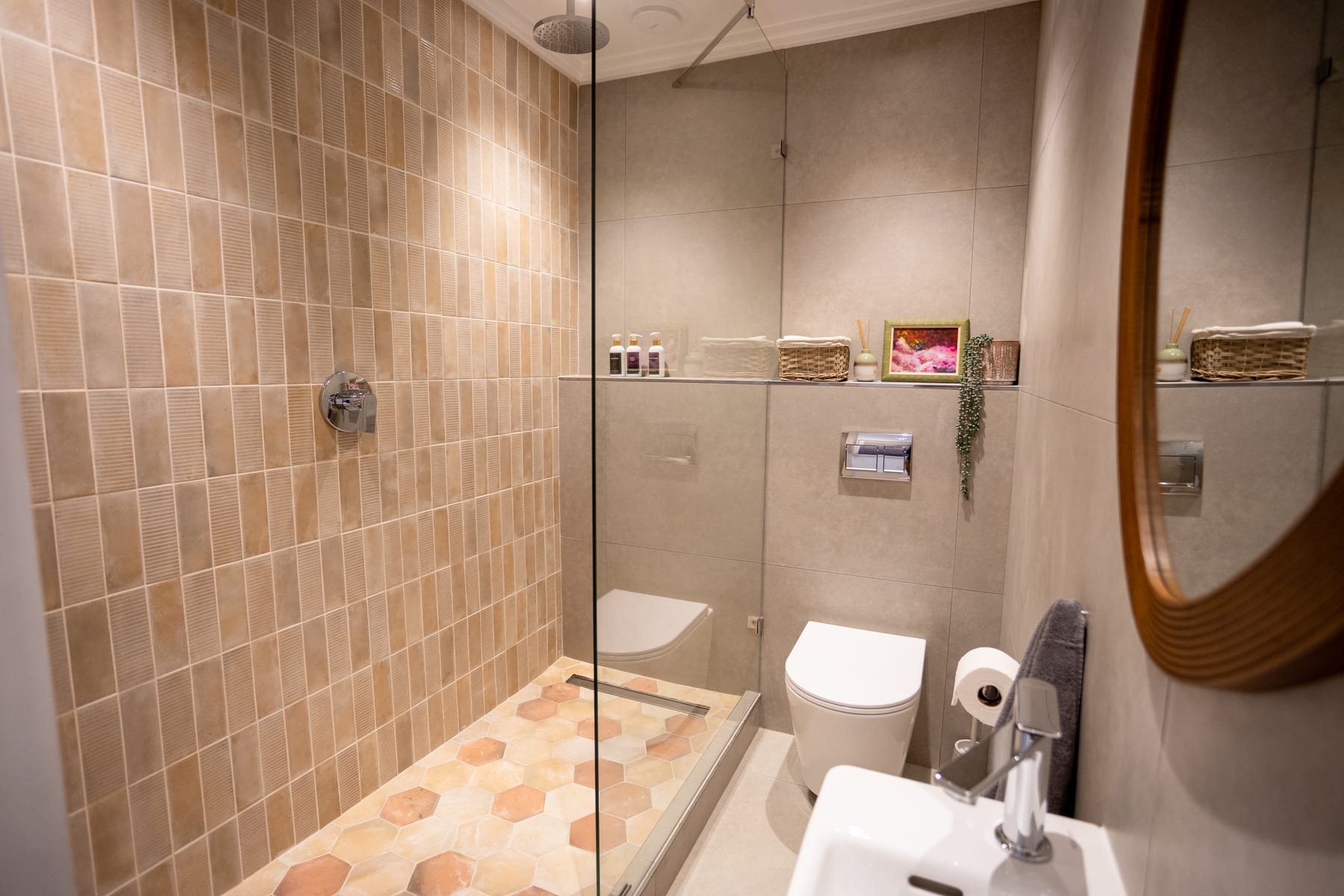 Second bathroom with a walk-in shower and warm patterned tiles