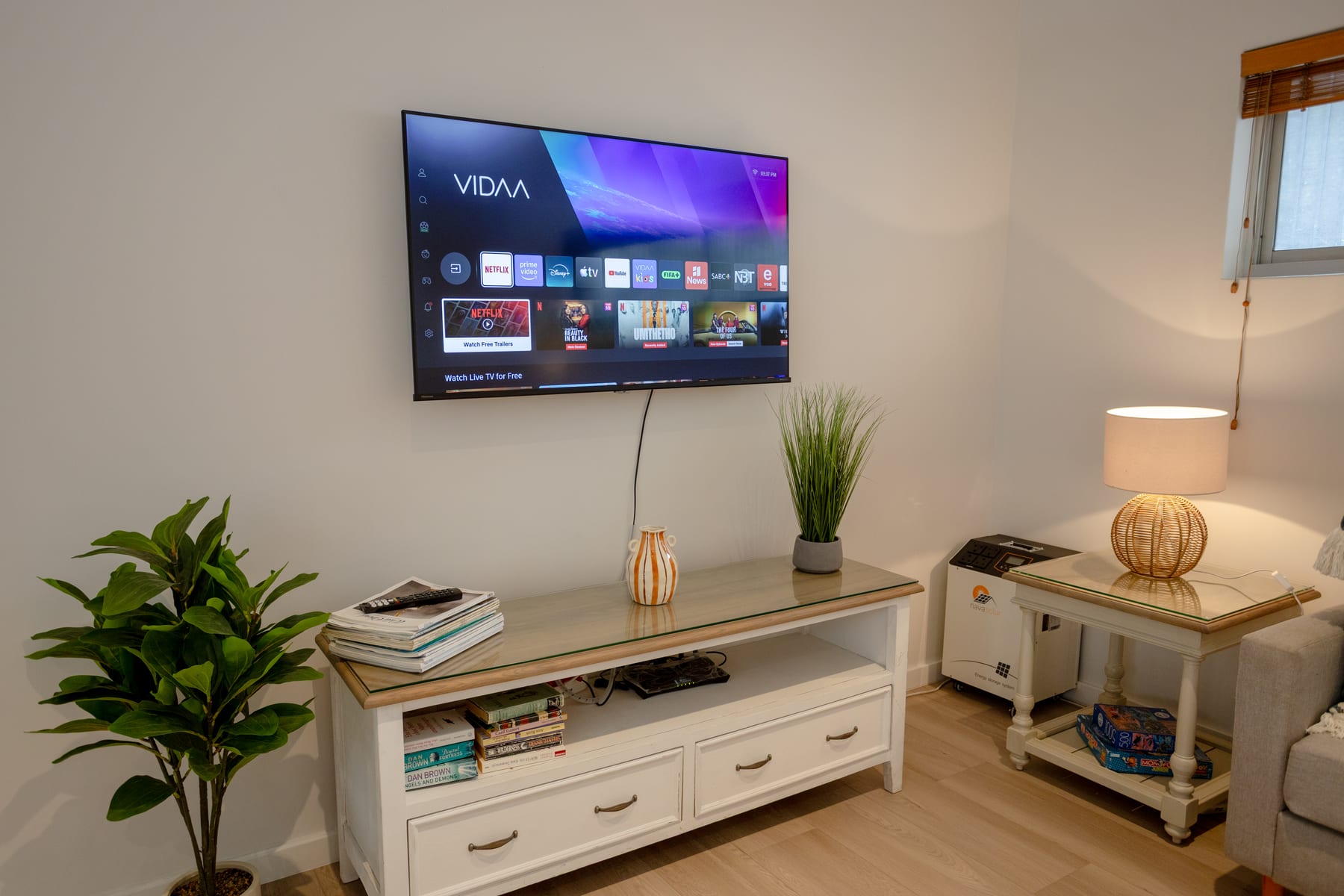 Smart TV, books and backup battery in the living room