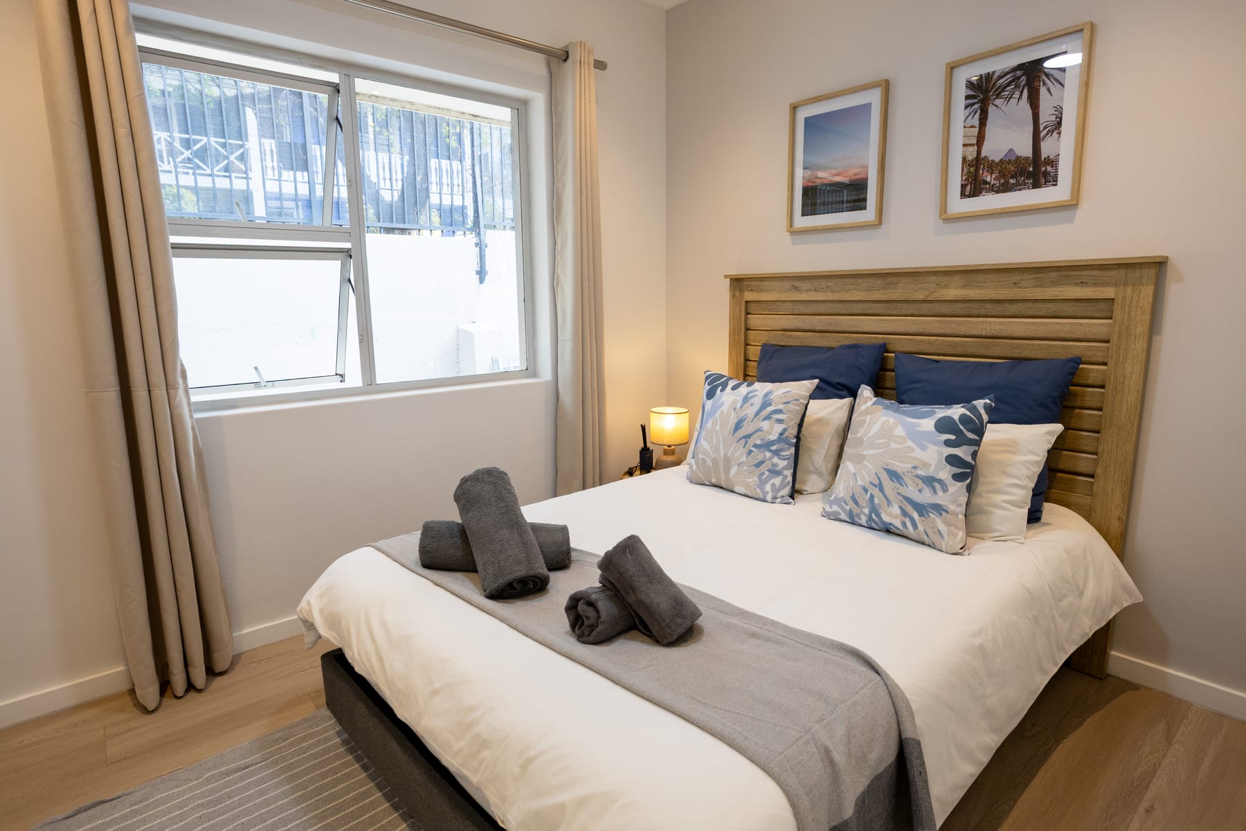 Third bedroom with a double bed and blue cushions