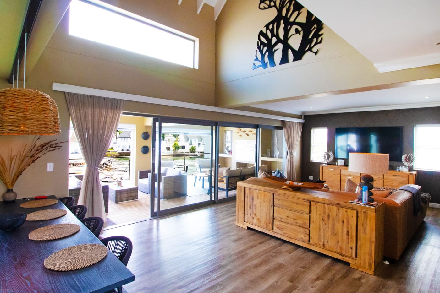 Open-plan living room with canal-facing doors